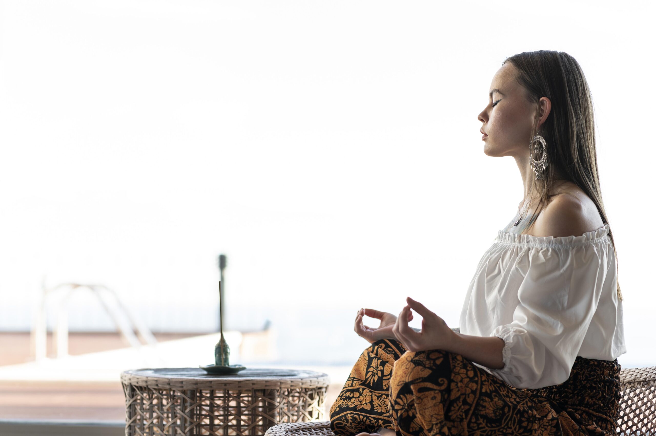 woman meditating outdoors scaled